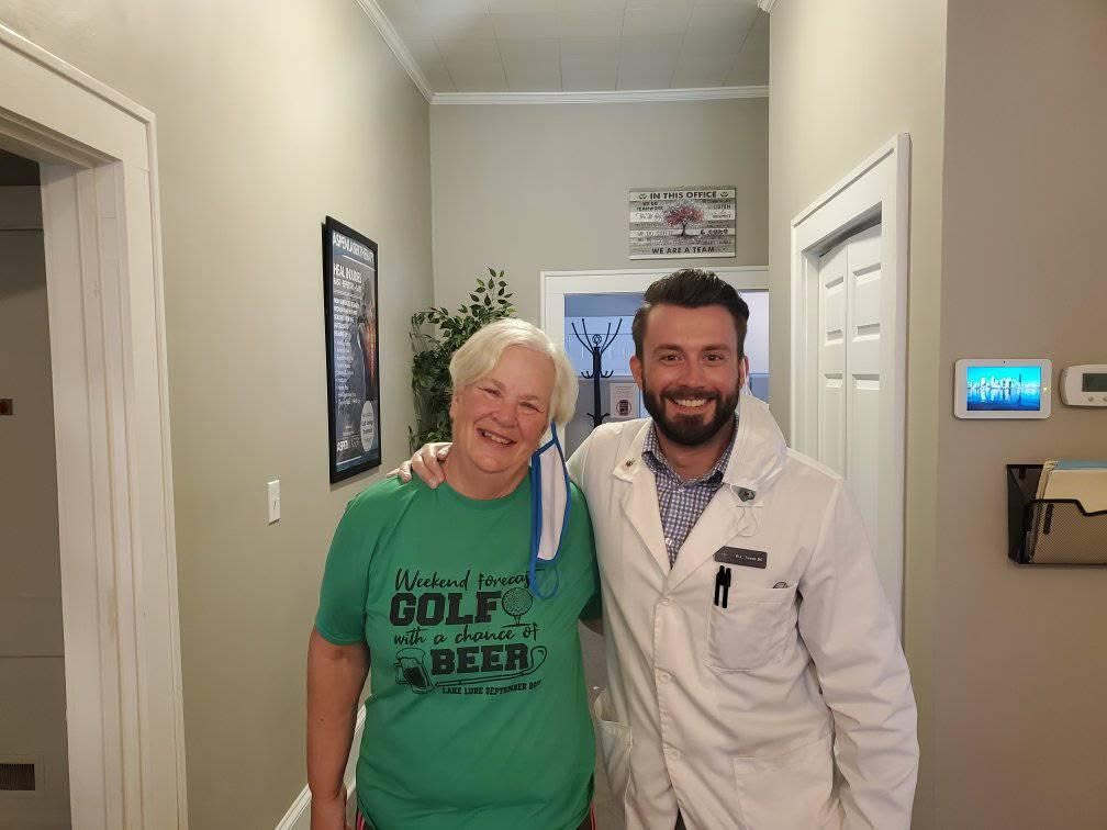 Our chiropractors in Lexington, SC, with a patient treated for knee pain.